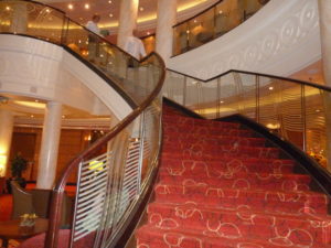 Grand Staircase in the atrium of Queen Mary 2 leading from deck 3 down to deck 2, the lowest passenger deck.