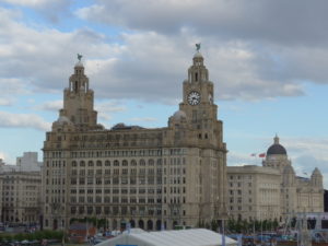 Royal Liver Building, Cunard Building, and Port of Liverpool Building. Dora saw these buildings when she was saying good-bye to Edward