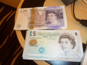 We count our British pounds sterling in preparation for shore excursion on July 13